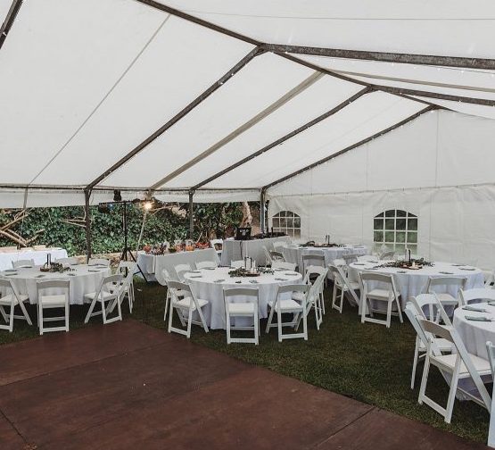 White Marquette tent with tables and chairs